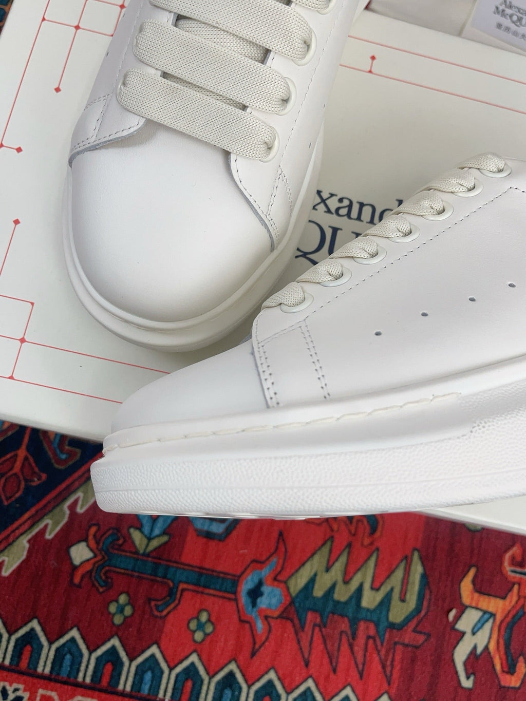 OVERSIZED SNEAKER IN WHITE CALFSKIN WITH EMBOSSED HUNTER GREEN HEEL TAB