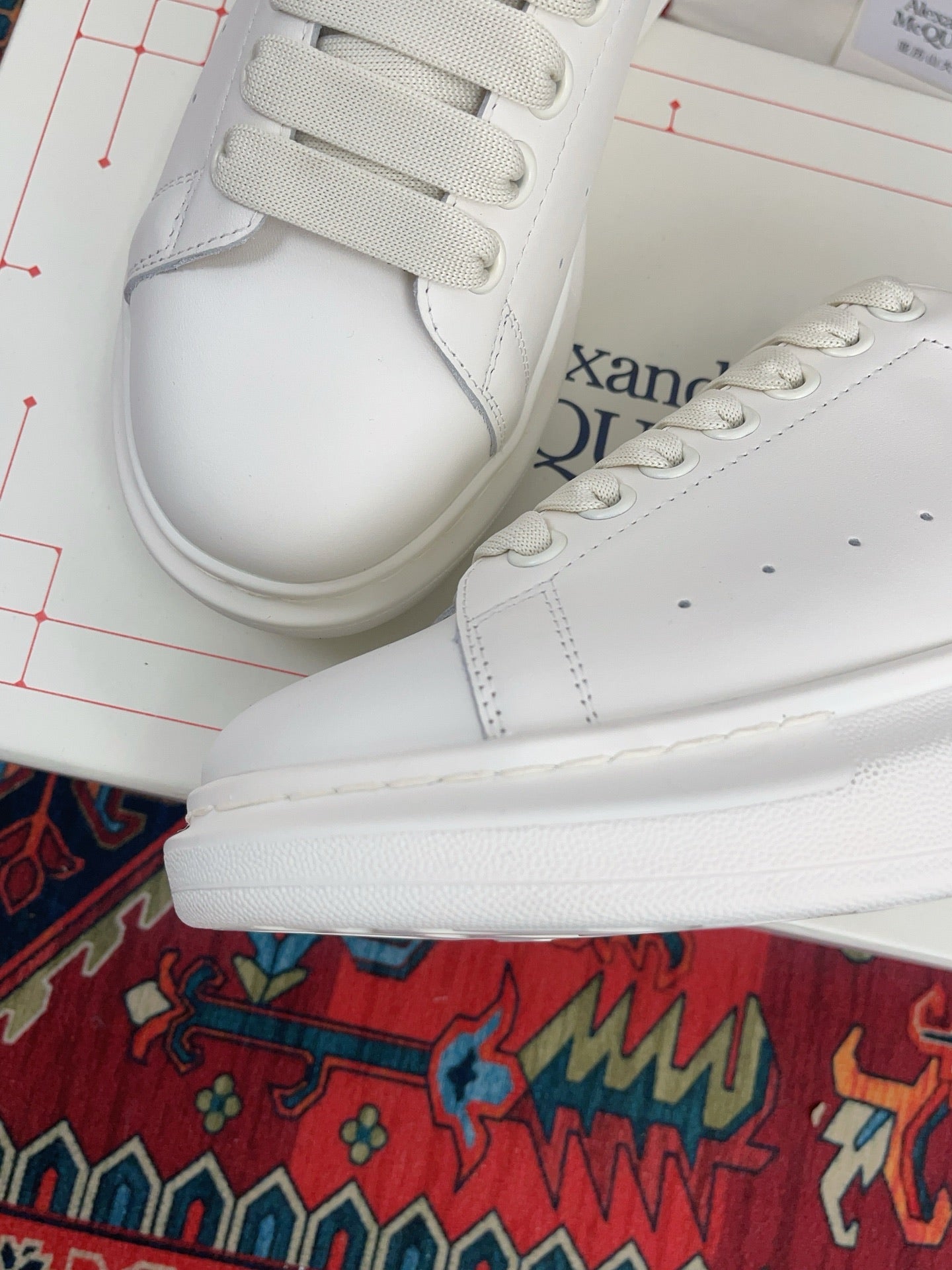 OVERSIZED SNEAKER IN WHITE CALFSKIN WITH EMBOSSED HUNTER GREEN HEEL TAB