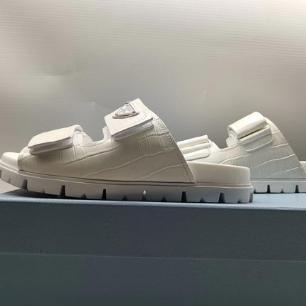 PRADA 26S STRAP SLIDES IN IVORY WHITE CROC EMBOSSED CALFSKIN