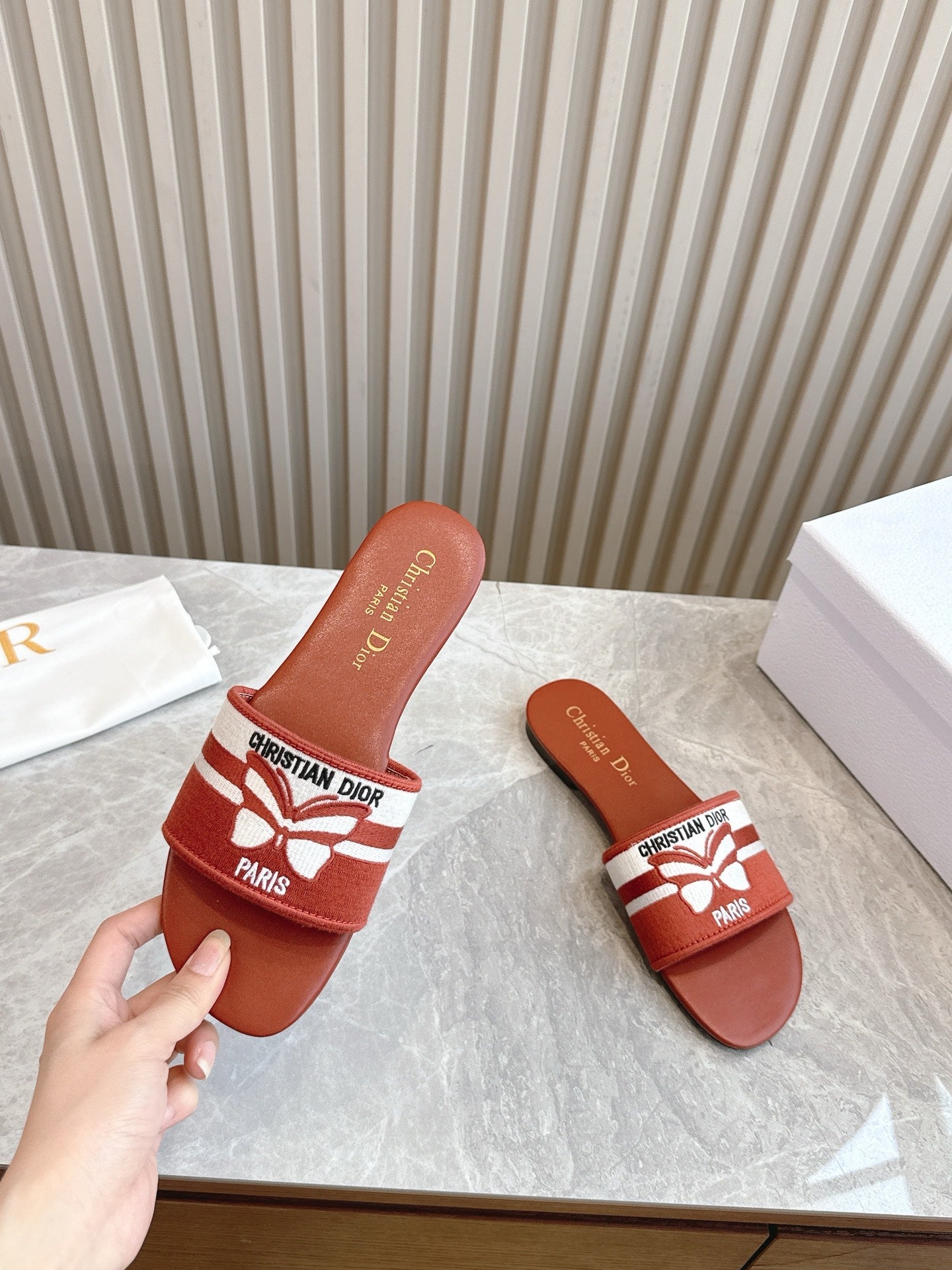 DIOR FLAT SLIDES 25S IN DARK ORANGE CALFSKIN AND FABRIC BRAND NAME EMBROIDERY