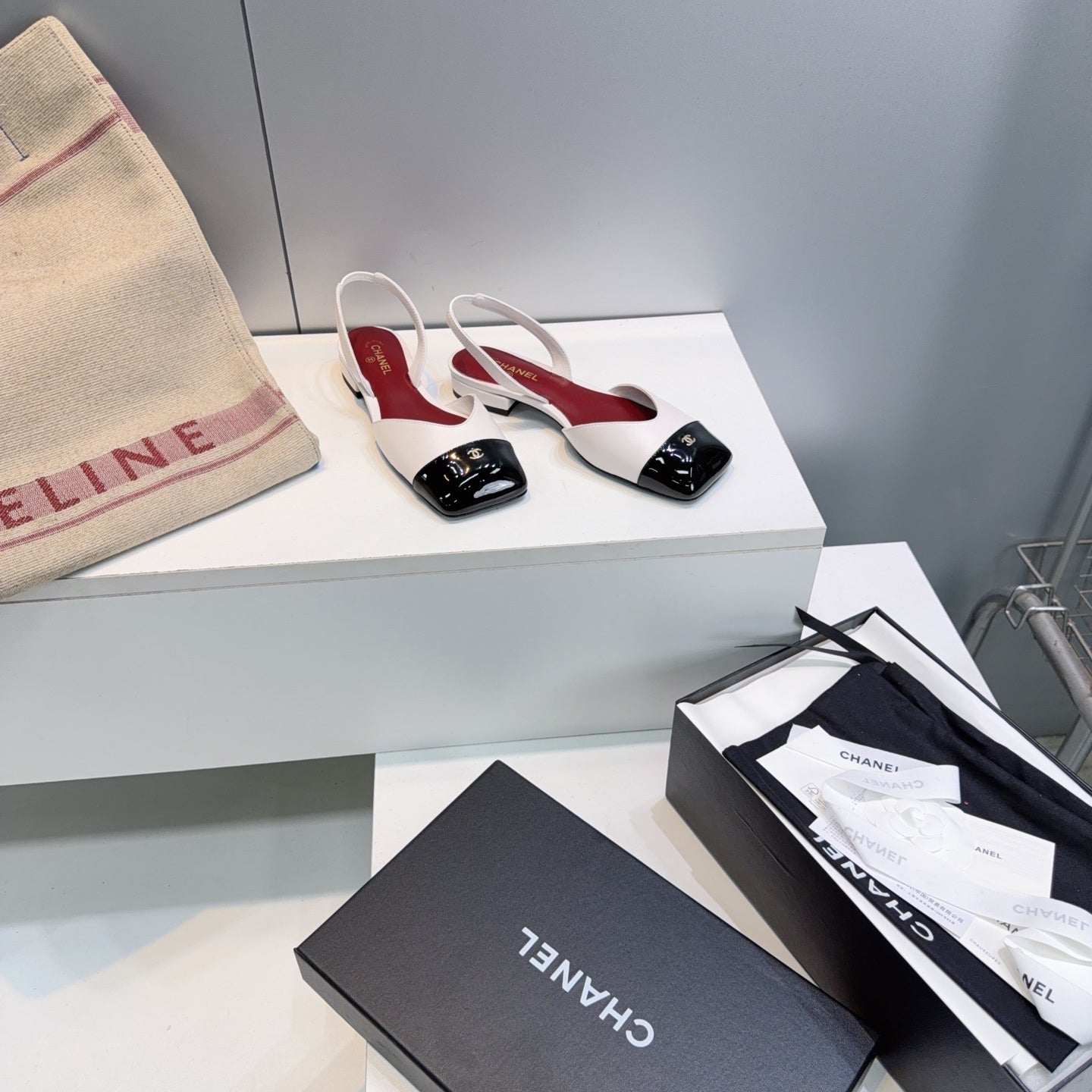 CHANEL 26S FLAT SLINGBACK IN WHITE LAMBSKIN WITH BLACK CAP TOE
