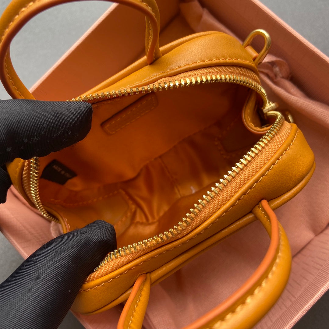 MICRO BAG KEYCHAIN 11  IN INDOCHINE ORANGE CALFSKIN EMBOSSED LOGO