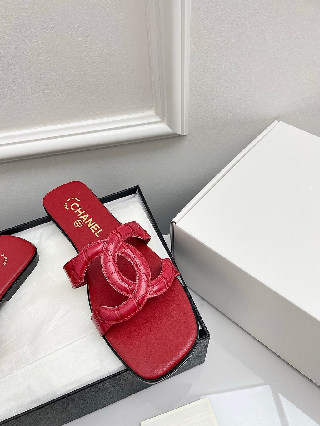 CHANEL CC LOGO MULES IN RED CALFSKIN