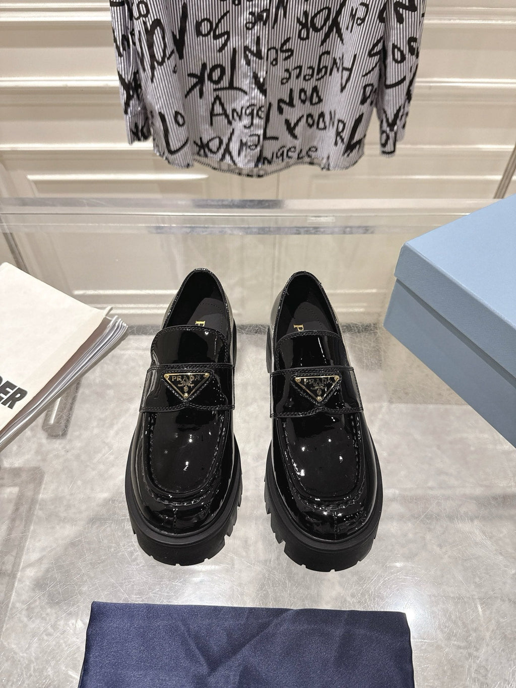 PRADA 26S PLATFORM LOAFERS 45MM IN BLACK PATENT CALFSKIN