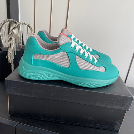 PRADA 26S AMERICA CUP SNEAKERS IN TEAL BLUE SOFT RUBBER AND BIKE FABRIC