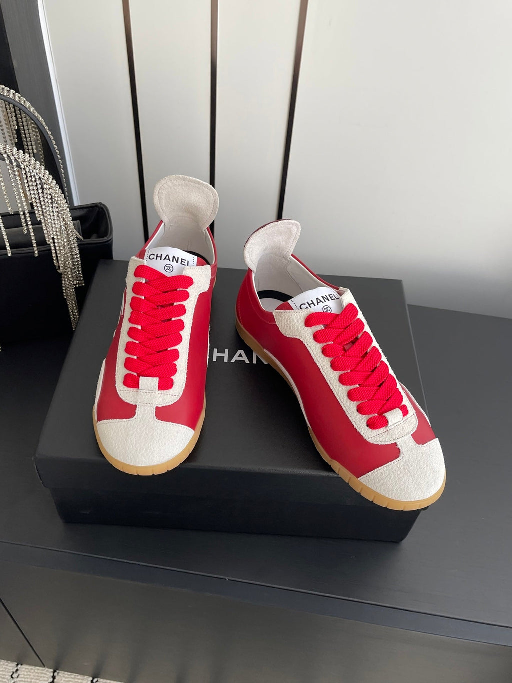 CHANEL LOW-TOP SNEAKERS IN RED CALFSKIN MIX SUEDE