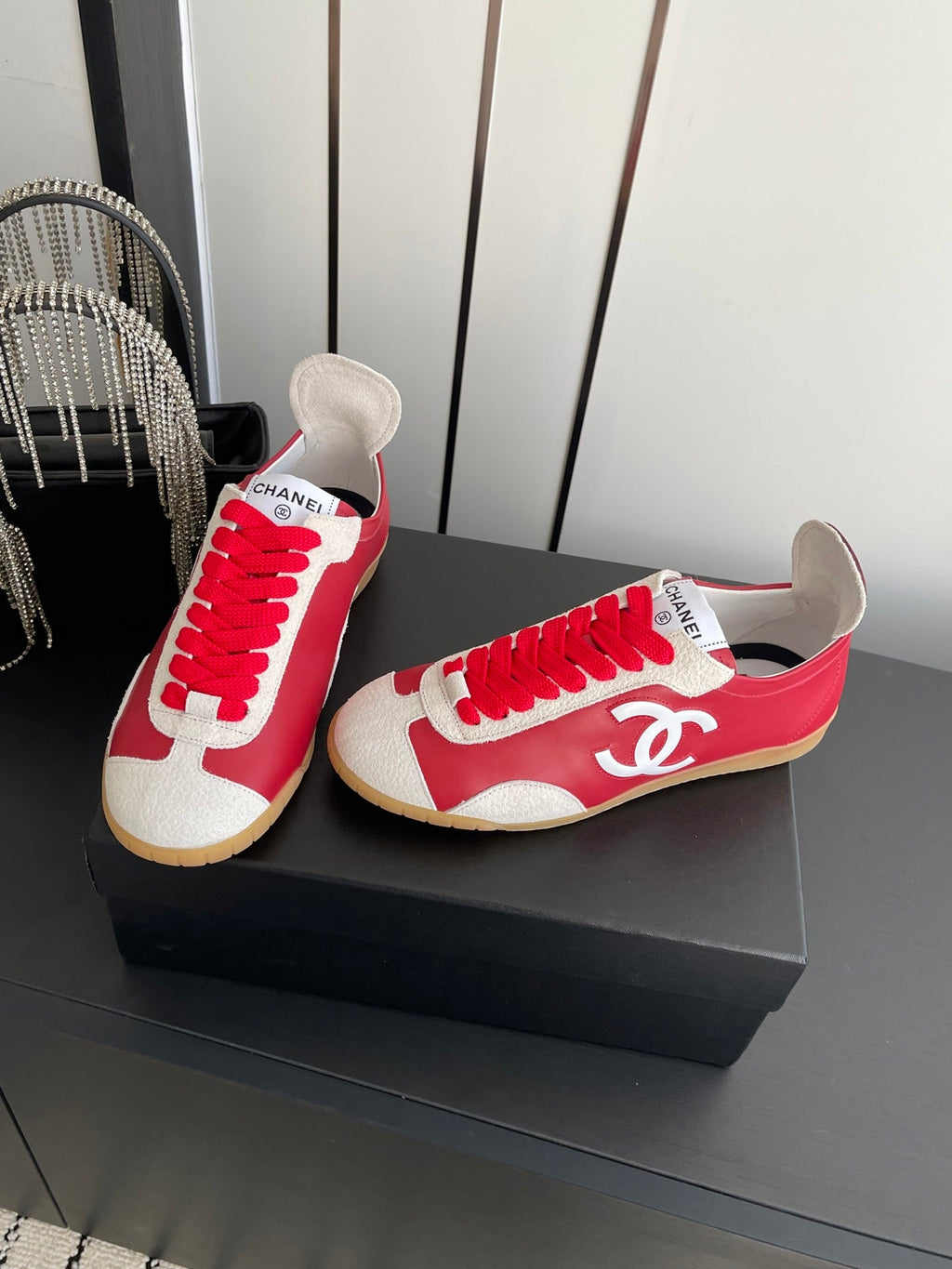 CHANEL LOW-TOP SNEAKERS IN RED CALFSKIN MIX SUEDE