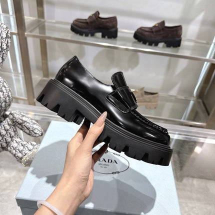 PRADA 25S THICK-SOLE LOAFERS 60 MM IN BLACK CALFSKIN