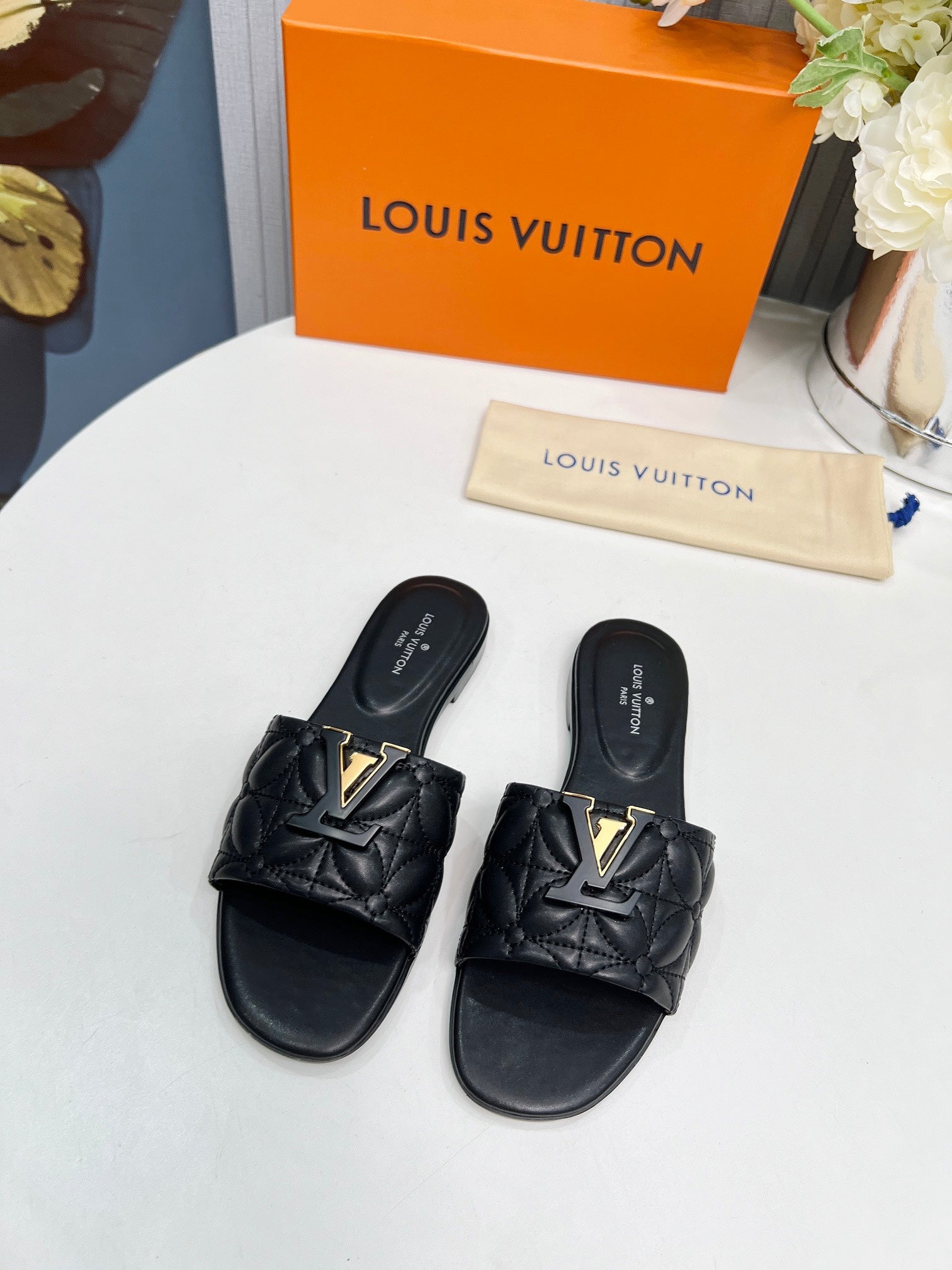 LV 26S MARE FLAT MULES IN BLACK CALFSKIN