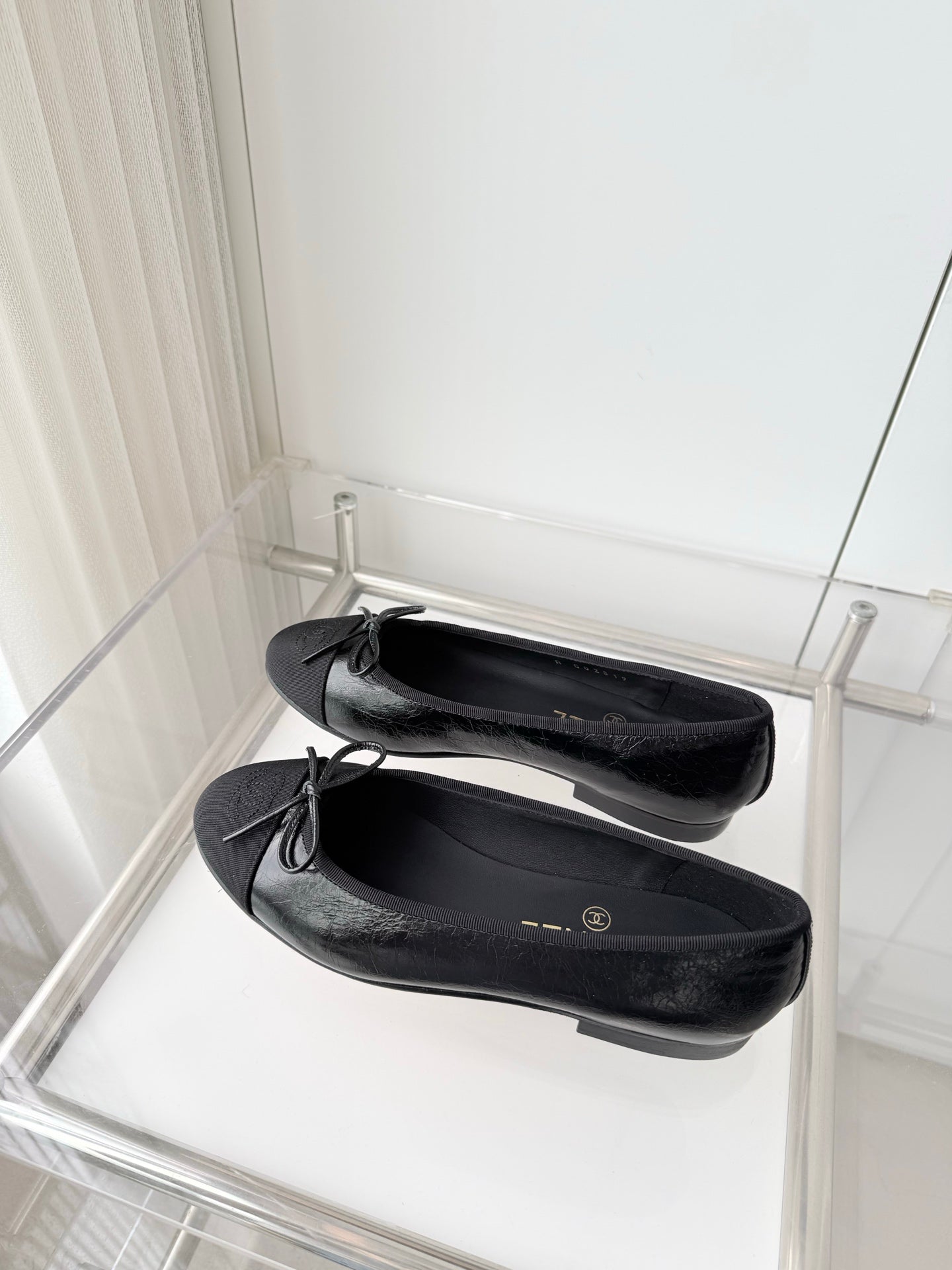 CHANEL 26S BALLET FLATS IN BLACK CALFSKIN WITH FABRIC TOE CAP AND BOW