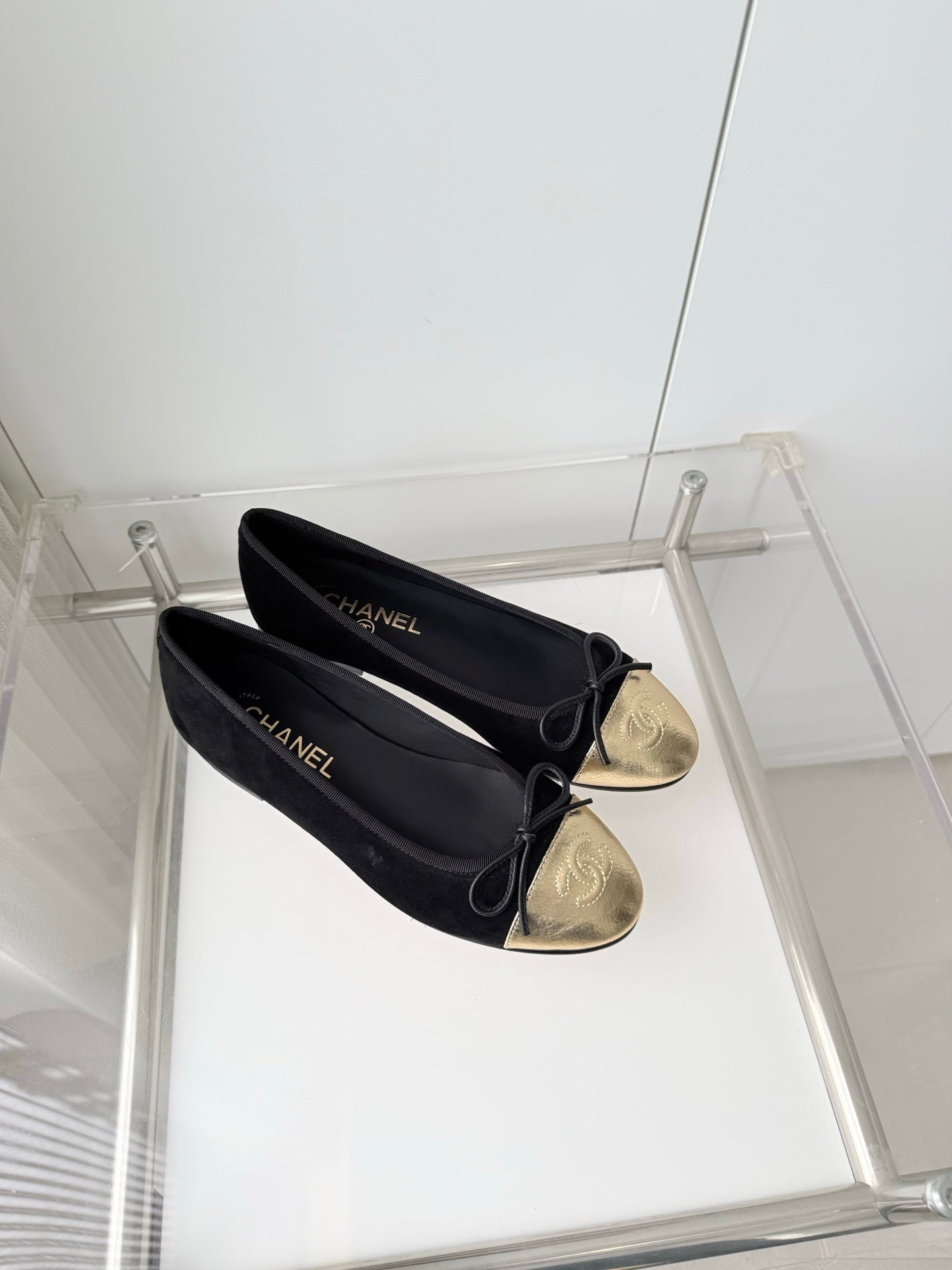 CHANEL 26S BALLET FLATS IN BLACK SUEDE WITH GOLD TOE CAP AND BOW