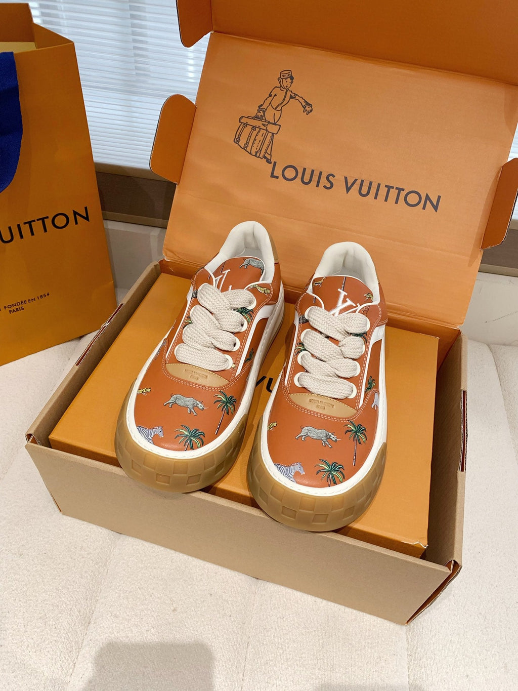 LV 26S TILTED SNEAKERS IN COGNAC ORANGE CALFSKIN SAFARI PRINT