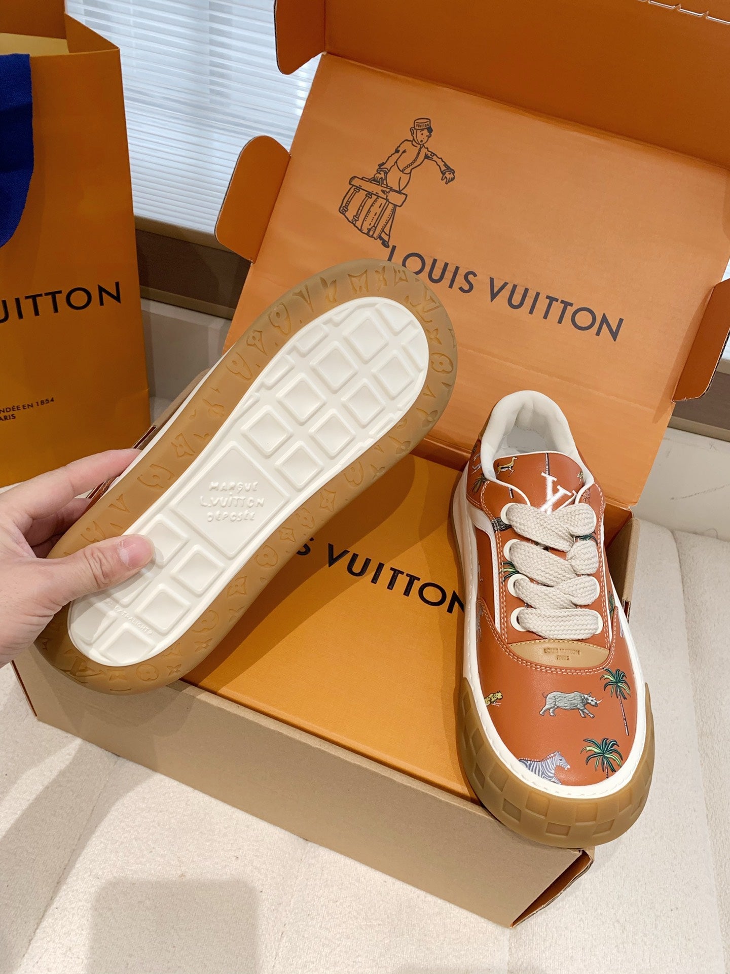 LV 26S TILTED SNEAKERS IN COGNAC ORANGE CALFSKIN SAFARI PRINT