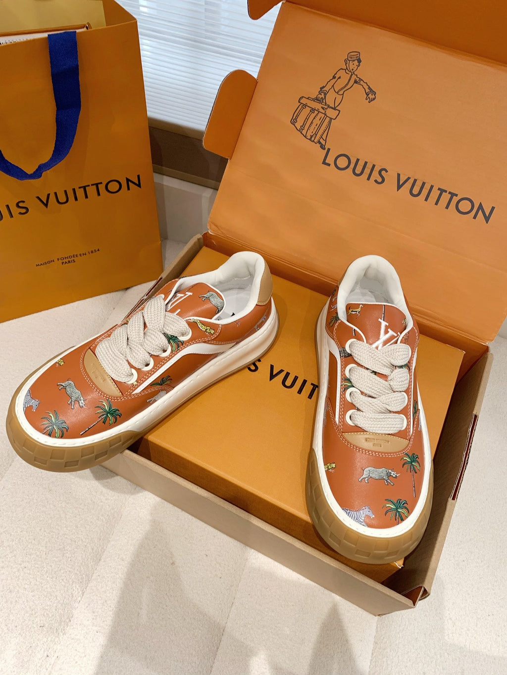 LV 26S TILTED SNEAKERS IN COGNAC ORANGE CALFSKIN SAFARI PRINT