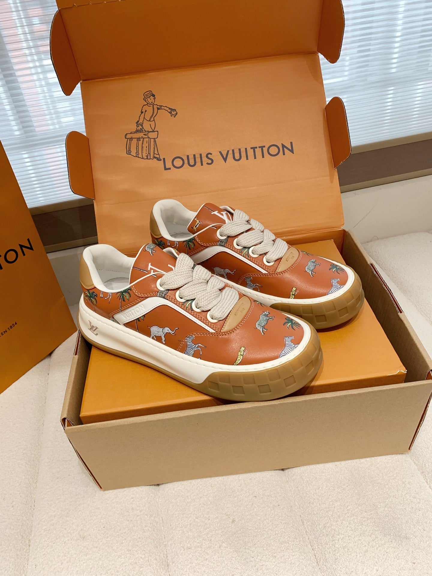 LV 26S TILTED SNEAKERS IN COGNAC ORANGE CALFSKIN SAFARI PRINT