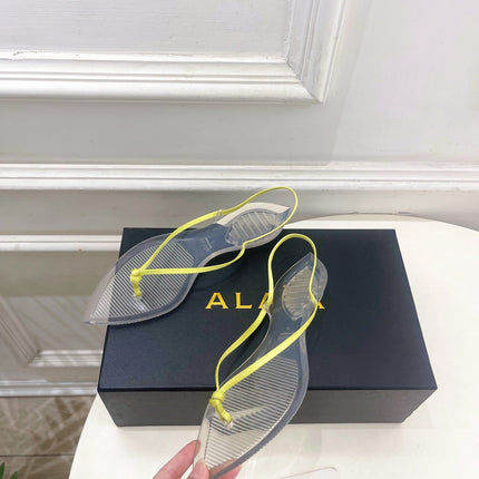 ALAIA 26S POINTED-TOE THONG SANDALS IN LIGHT YELLOW SATIN AND TRANSPARENT PVC