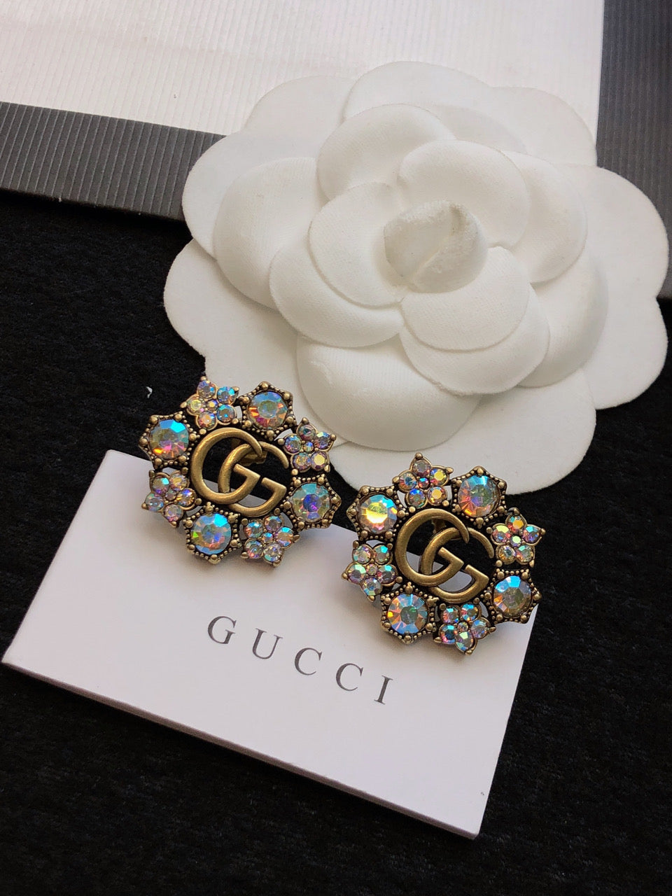 GUCCI 26S DOUBLE G LOGO MULTICOLOR CRYSTAL FLORAL STATEMENT STUD EARRINGS IN AGED GOLD TONE METAL 629028