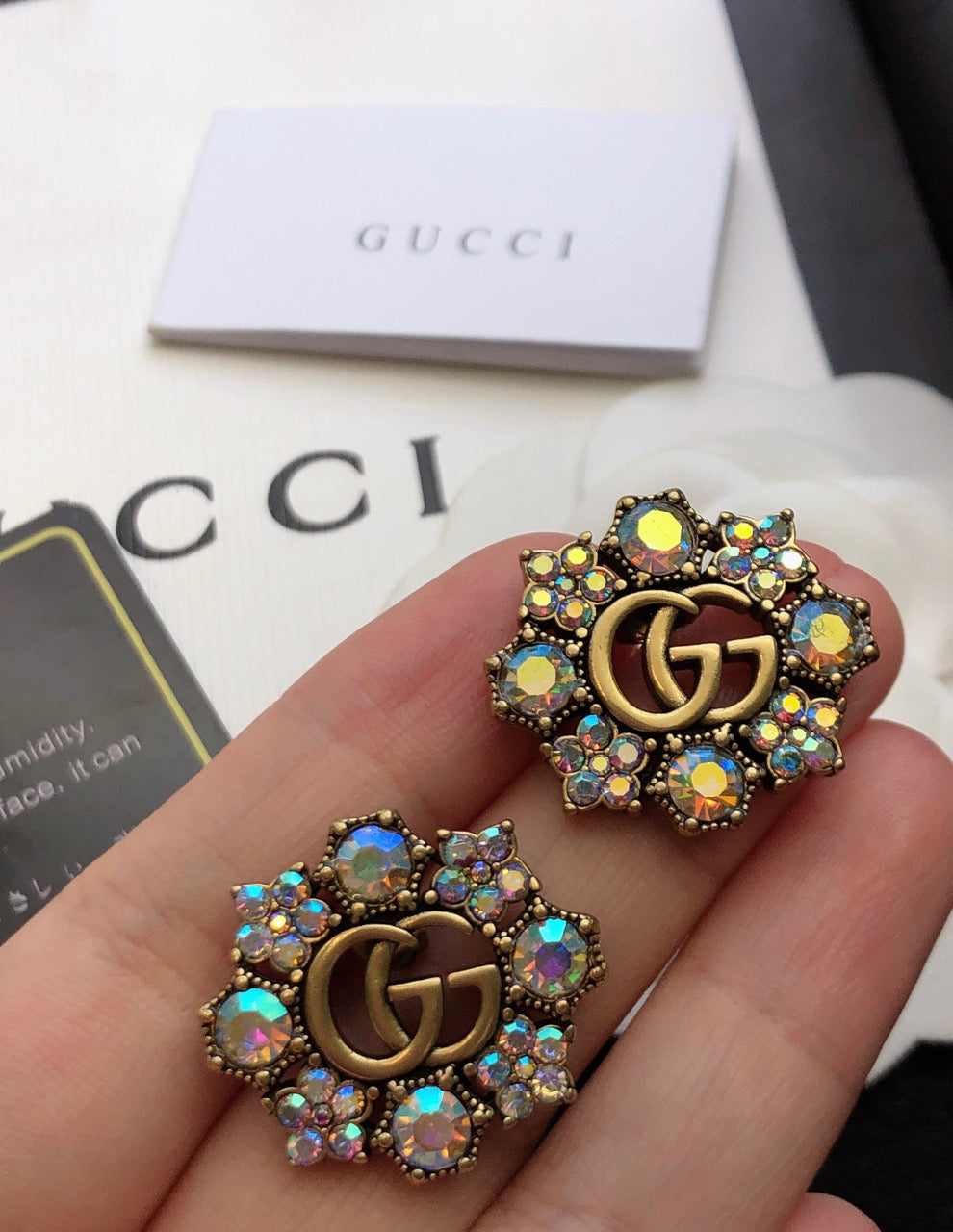 GUCCI 26S DOUBLE G LOGO MULTICOLOR CRYSTAL FLORAL STATEMENT STUD EARRINGS IN AGED GOLD TONE METAL 629028